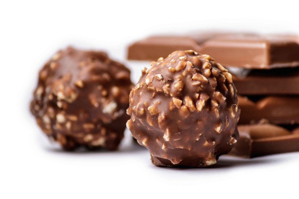 chocolate bonbons covered with nuts with chocolate bars
